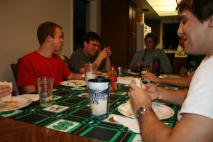 ACE teachers Kevin Casey, left, Joe Augustinsky and Brianna Hohman share a laugh as they enjoy Taco Night at home.