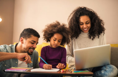 Parents helping a child with homework